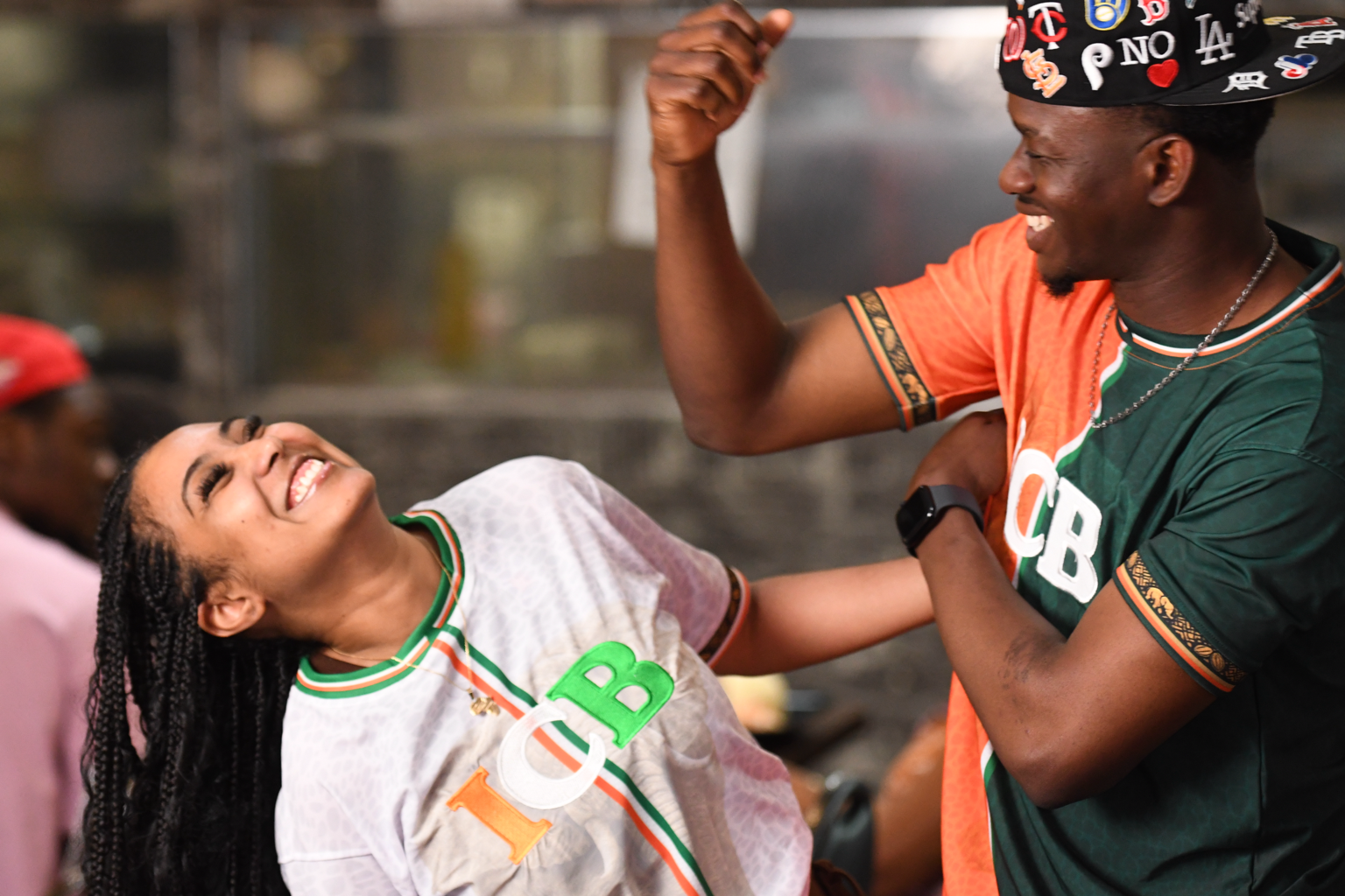 ICI C’EST BABI lifestyle campaign — two people wearing ICB jerseys and celebrating together